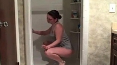 Hot milf cleaning the shower showing her ass
