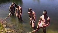 Four guys go skinny dipping and explore each other's masculine cocks